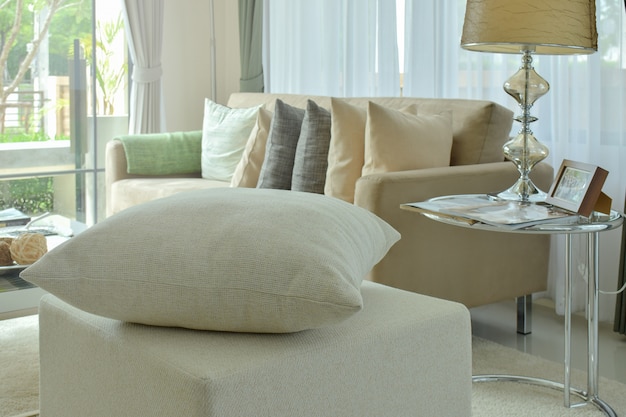 Photo off-white pillow on stool in modern interior living area