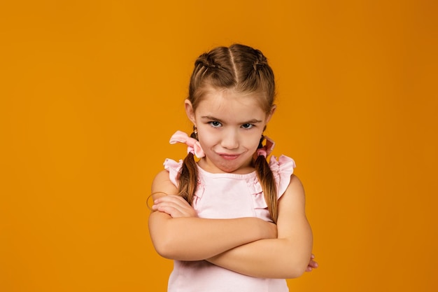 Offended sad little child girl in dress