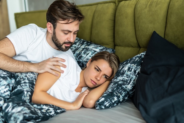 Offended woman doesnt speak with his man while lying in the bed