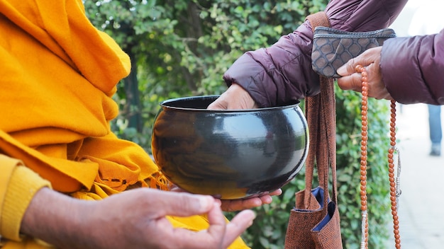 offer food to the monk in india