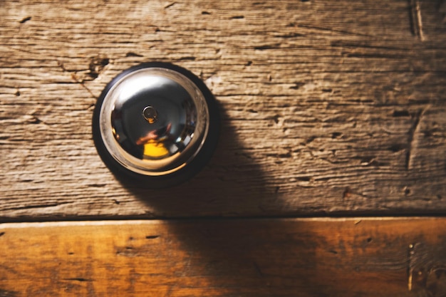 Office bell on wooden table