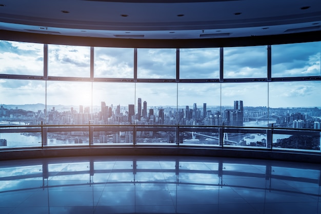 Office building glass and city skyline