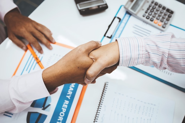 Office business man shaking hands top view.