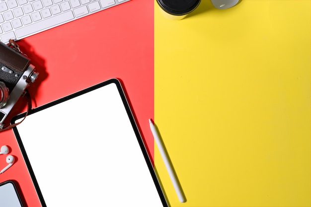 Office colourful desk working space and mockup tablet