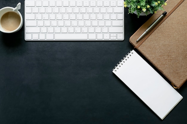 Office dark blue leather table top with office gadget and copy space.