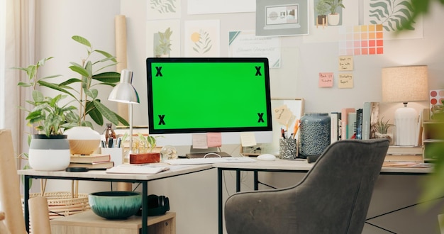 Photo office desk and computer with green screen mockup and desktop placeholder for website design information pc monitor chromakey and space for media promo branding or logo in creative workplace