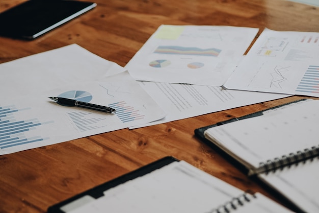 Office desk at morning with a financial documents