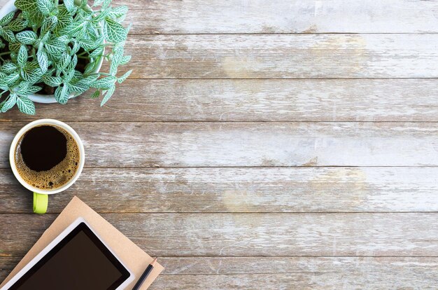 Office desk table Blank paper notebook with pencil and cup of coffee