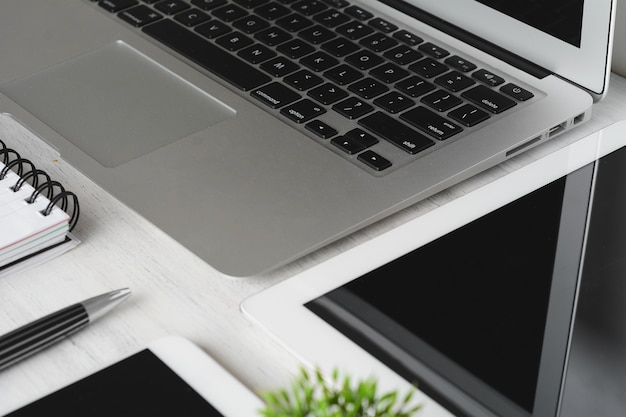 Office desk table with computer and supplies