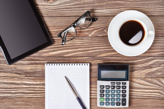 Photo office desk table with digital tablet and coffee cup