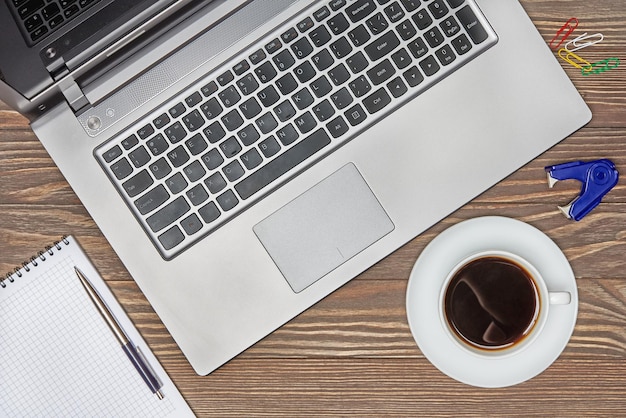 Office desk table with keyboard and coffee cup