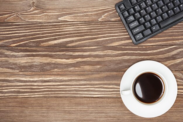 Office desk table with laptop and coffee cup