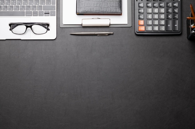 Photo office desk table with laptop and supplies