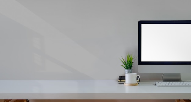 Office desk table with mockup computer 