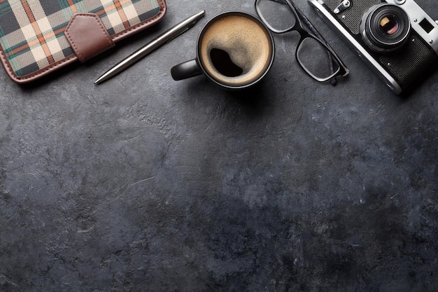 Office desk table with notepad camera and coffee