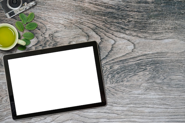 Office desk with blank screen mockup tablet and copy space.