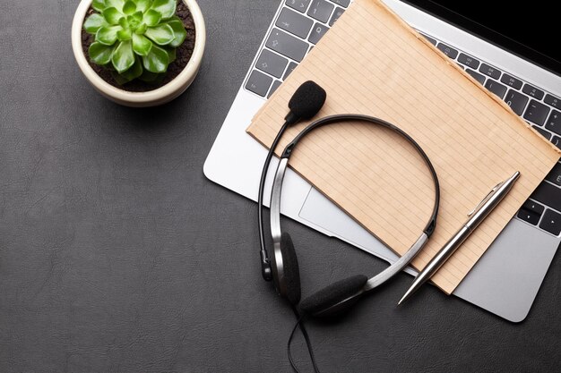 Office desk with headset and computer Remote office and work from home concept Top veiw flat lay with copy space