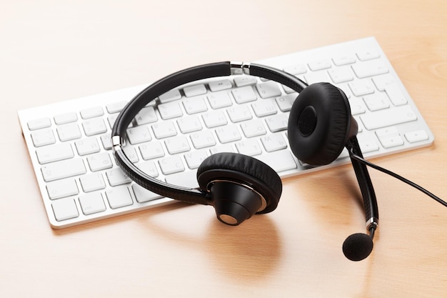 Office desk with headset and keyboard