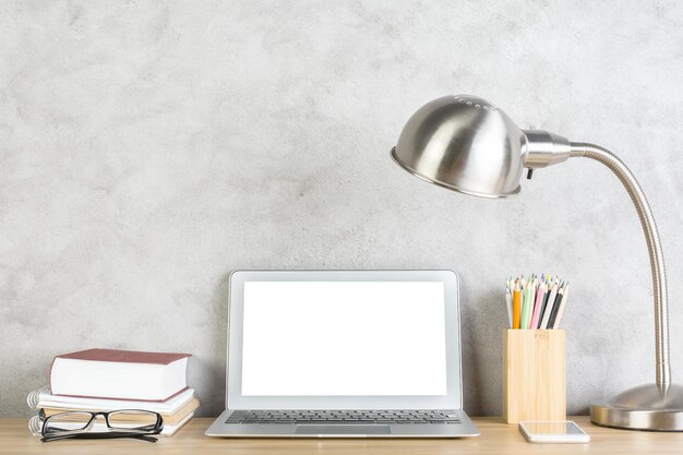 Office desk with white notebook closeup