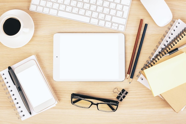 Office desk with white tablet