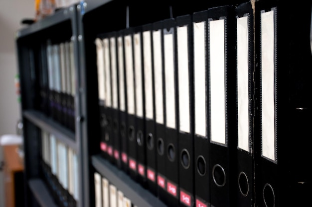 Office document folders standing in row