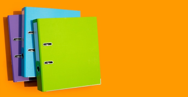 Office folders on orange