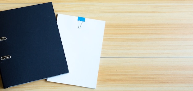 Photo office folders on wooden texture background.