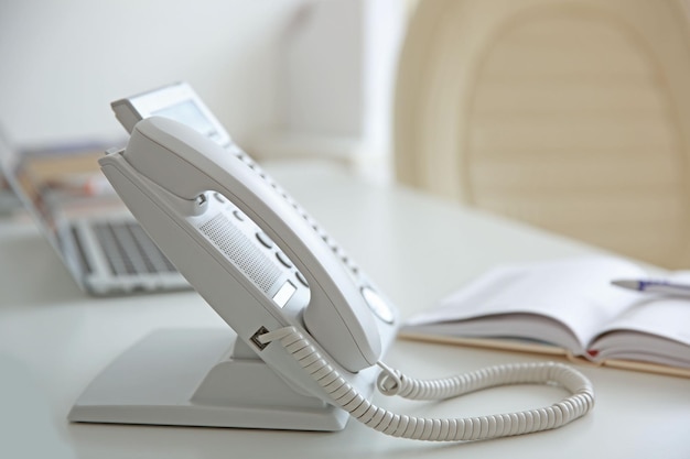 Office IP telephone on light background