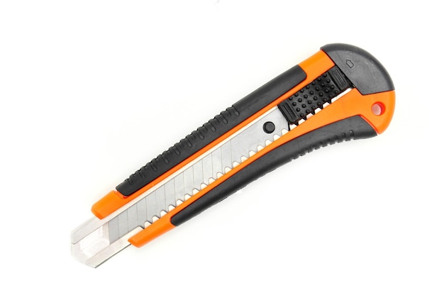 Office knife with replaceable blades on an isolated white backgroundxDxA