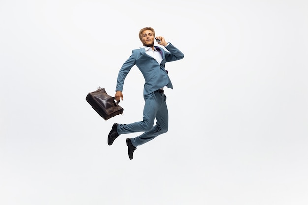 Photo office man running, jogging on white background