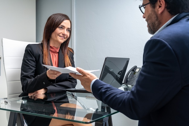 Office meeting between business man and woman.