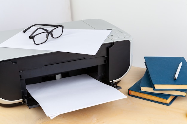 Office printer close up on a wooden table