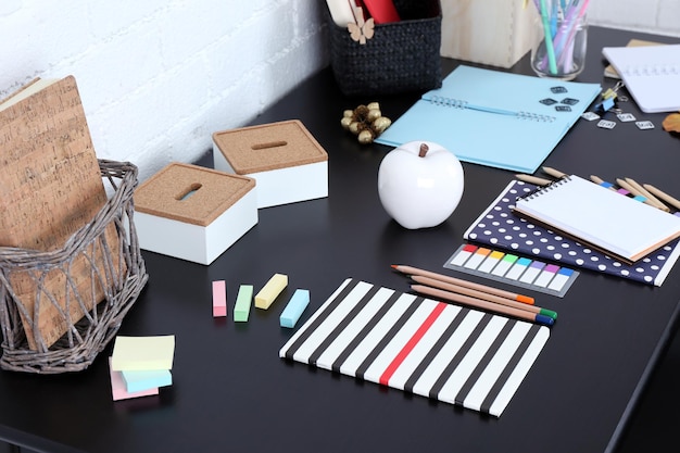 Office and school set with stationery and notebooks on a table