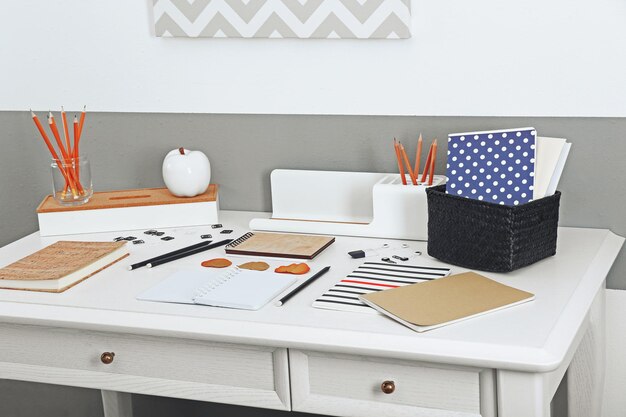 Photo office and school set with stationery and notebooks on a table