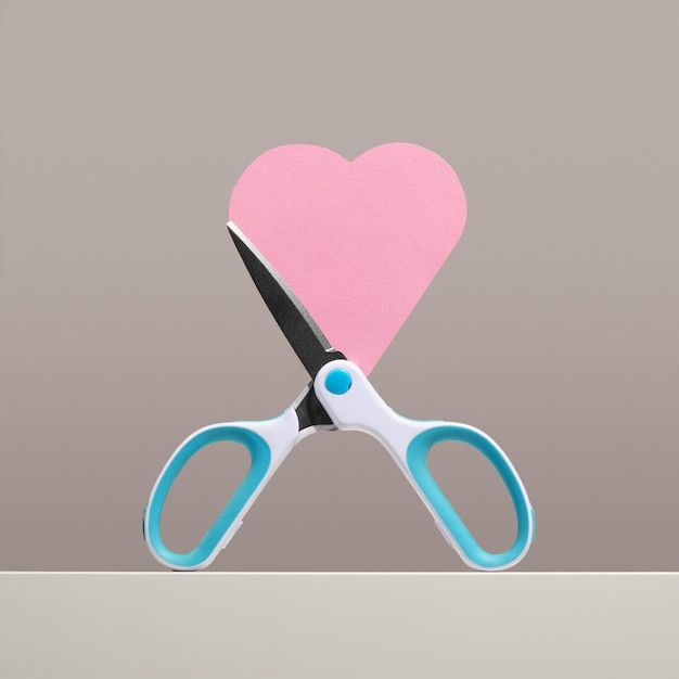 Office scissors and blades form pink heart Love of work and creative inspiration