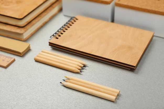 Office set with notebooks and stationery on grey background