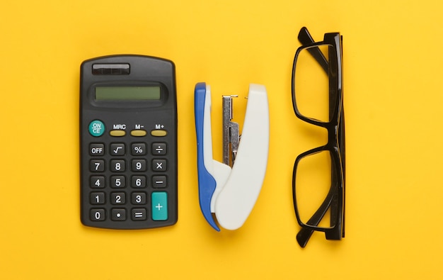 Office and stationery supplies on a yellow.