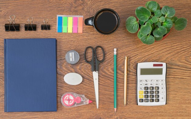 office stationery on wooden table top view.