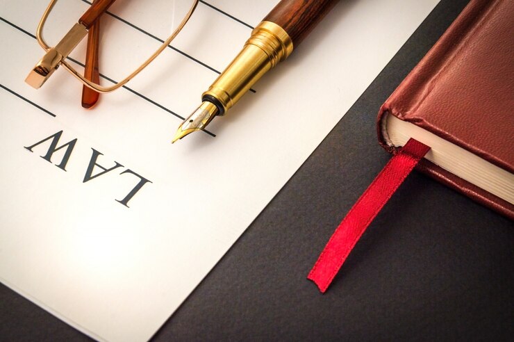Photo office still life on black table with pen on sheet and glasses preparing for recordings