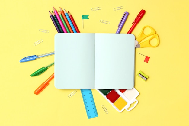 Office supplies on a colored background closeup back to school concept