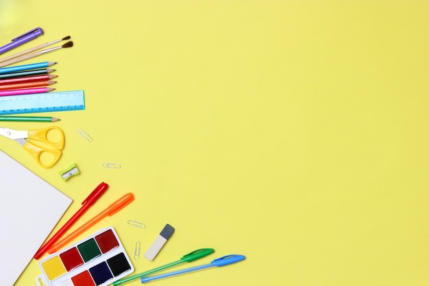 Office supplies on a colored background closeup back to school concept