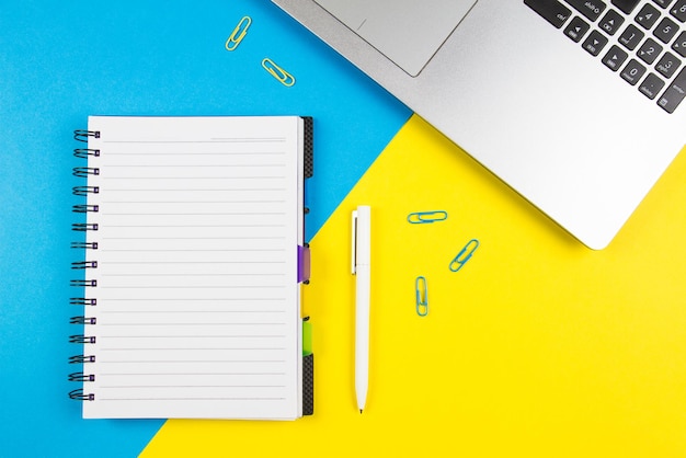 office supplies on colored background