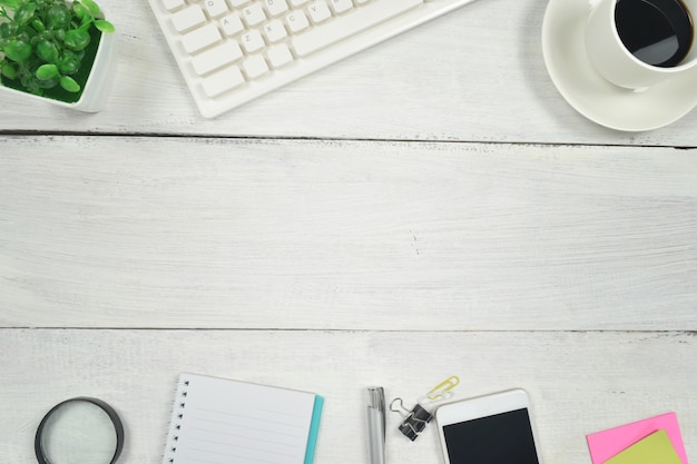 Photo office supplies on white wooden table