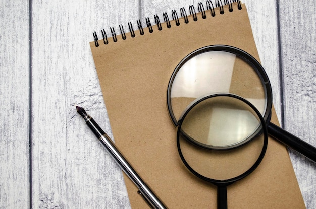 Office supplies with documents close up and wooden background