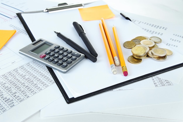 Office supplies with money and documents close up