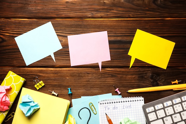 Office table with notepad, supplies.