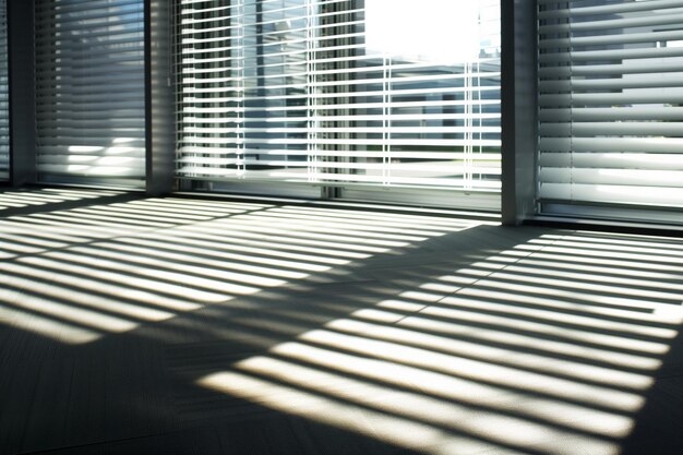 Photo office with blinds halfopen casting striped shadows on floor