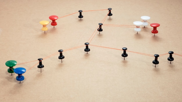 Office work abstract photo. Wired points on wooden surface.