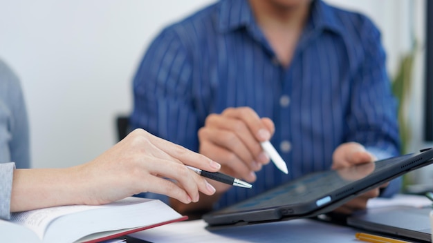 Office work concept a businessman showing a bar graph information