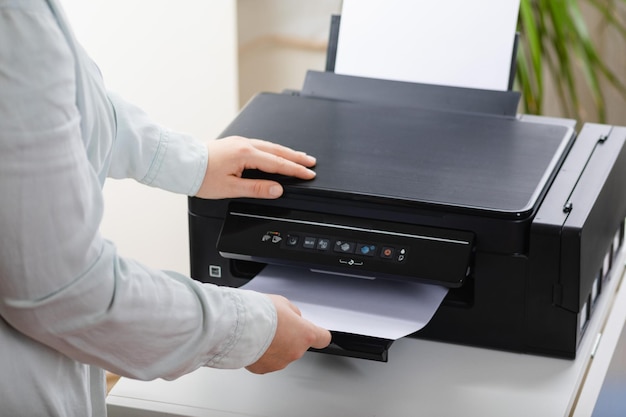 Office work secretary woman making a photocopy of important\
documents office manager using printer scanner or laser copy\
machine